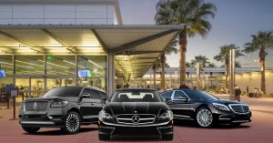 Three luxury black vehicles—a Lincoln Navigator SUV, a Mercedes-Benz sedan, and a Mercedes-Benz S-Class—parked in front of a modern airport terminal at dusk to represent Gainesville limo service options.