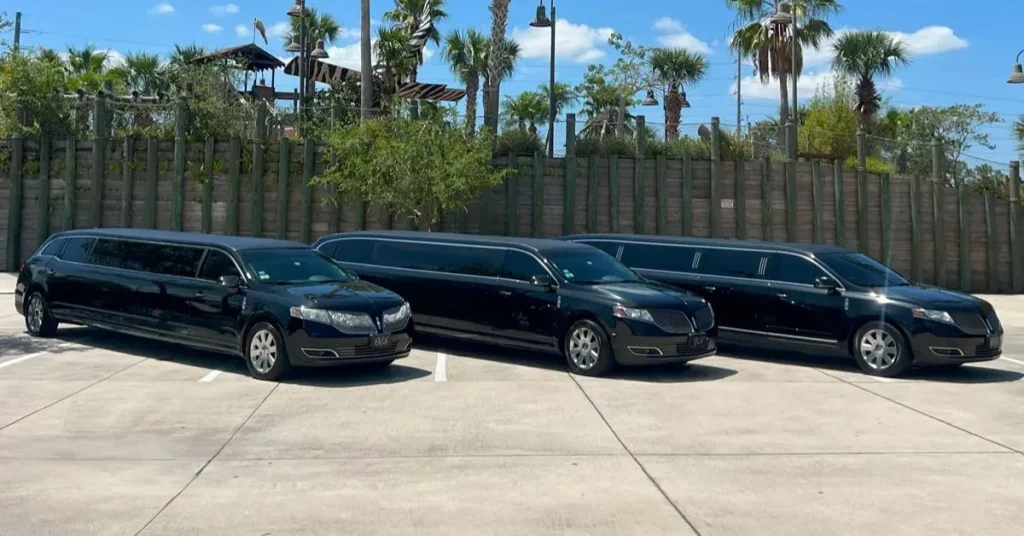 Three luxury black Lincoln MKT stretch limousines parked in a row, showcasing premium fleet options for an Alpharetta limo service providing professional chauffeured travel throughout North Fulton.